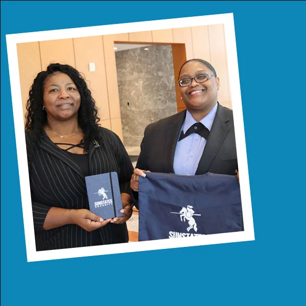 two people showing off imprinted promotional products