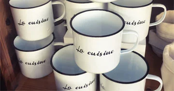 stack of custom imprinted mugs