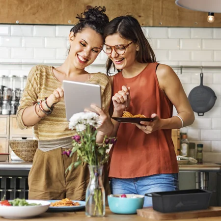 Two women cooking in a kitchen