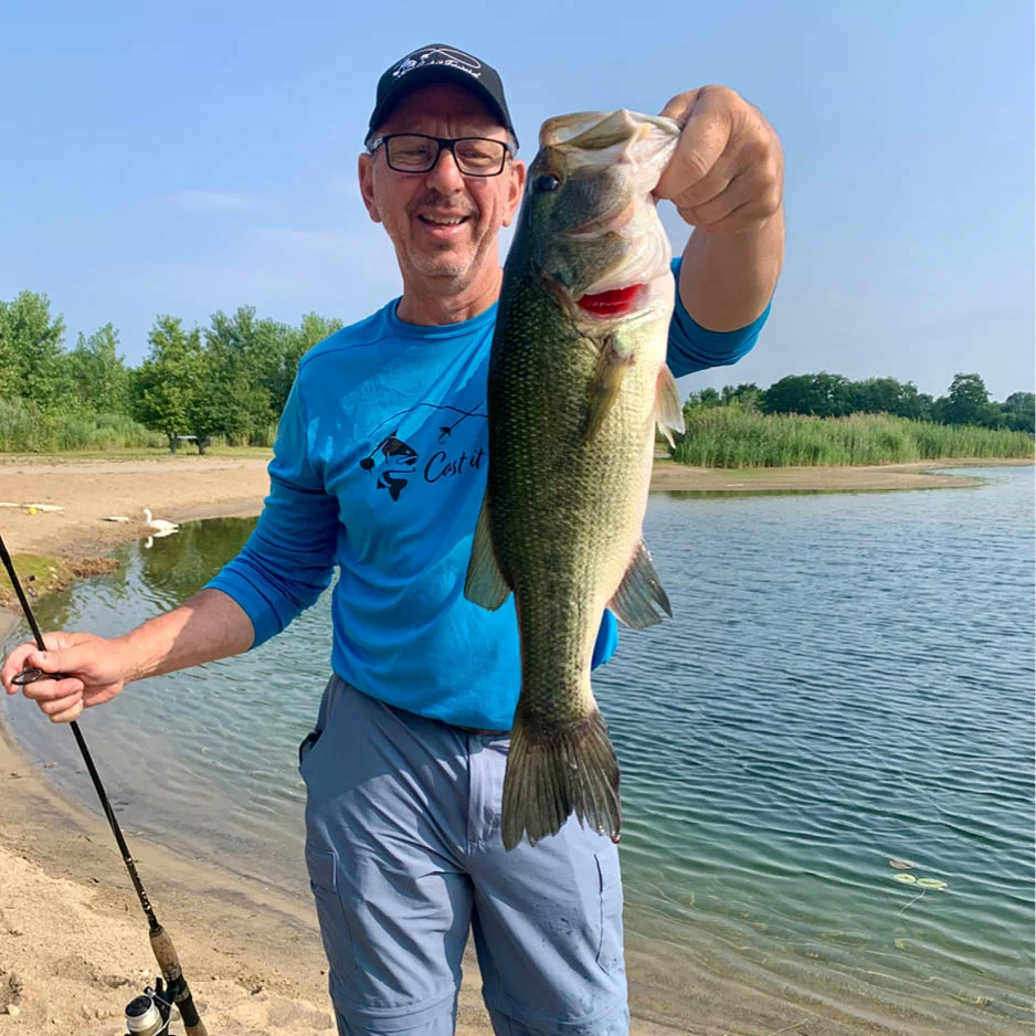 person holding up a fish