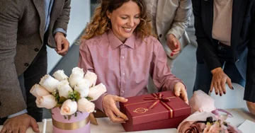 Woman receiving a present at the office