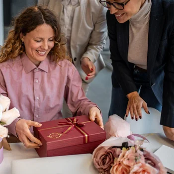 Woman receiving a present at the office
