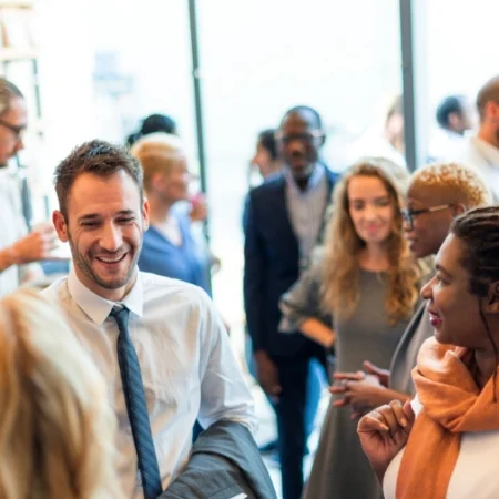 Group of smiling event attendees mingling