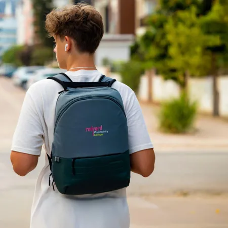 Man walking with a backpack on.