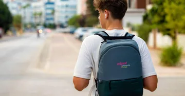 Man walking with a backpack on.