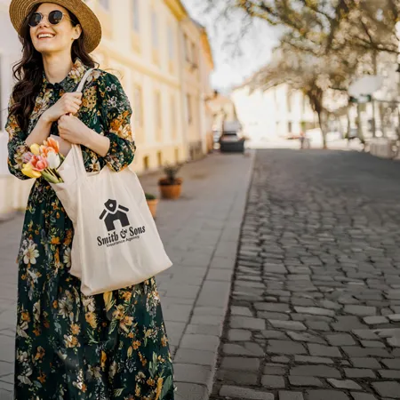 Woman shopping in a street with a cotton tote bag
