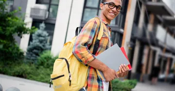 Person walking to class with backpack