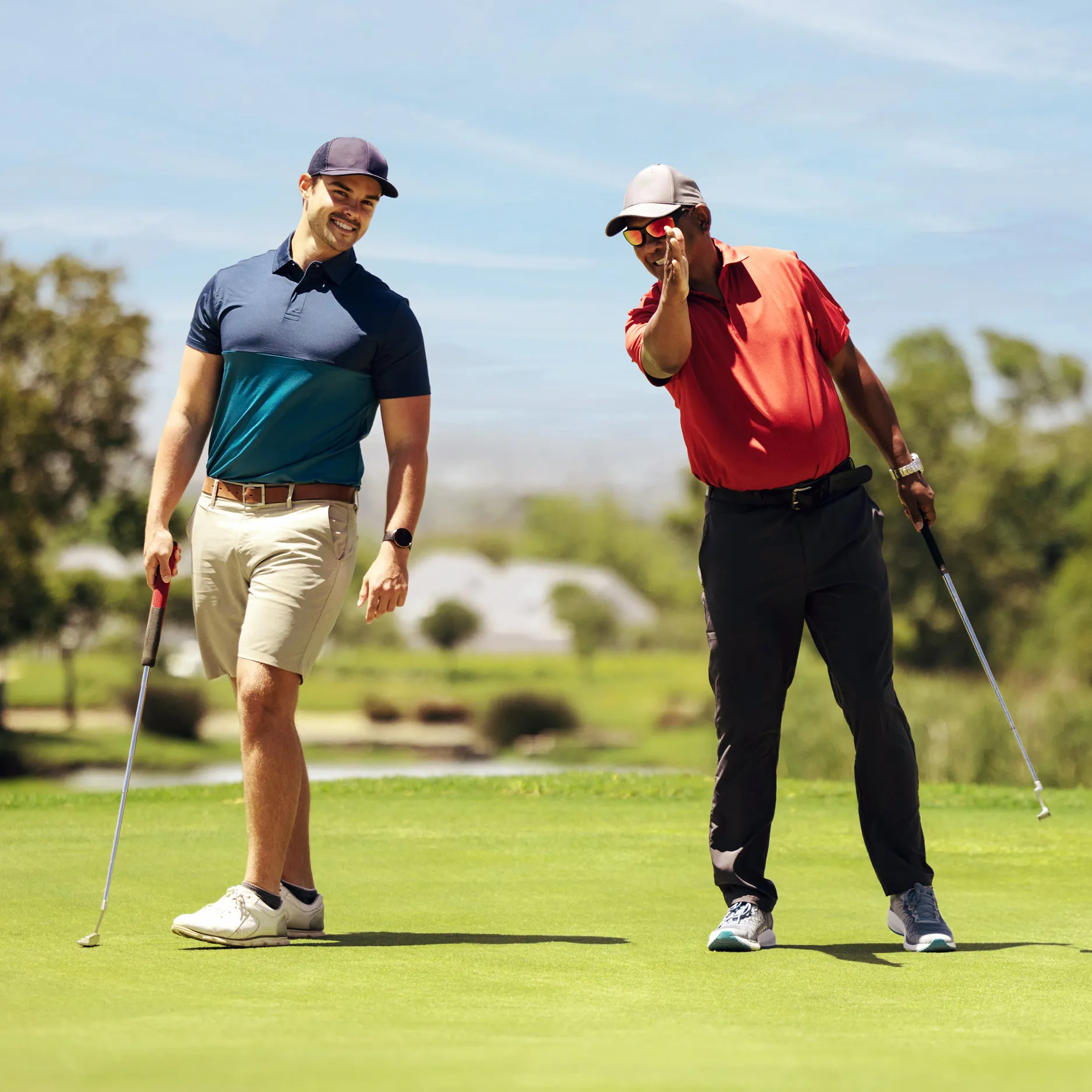 two people playing golf