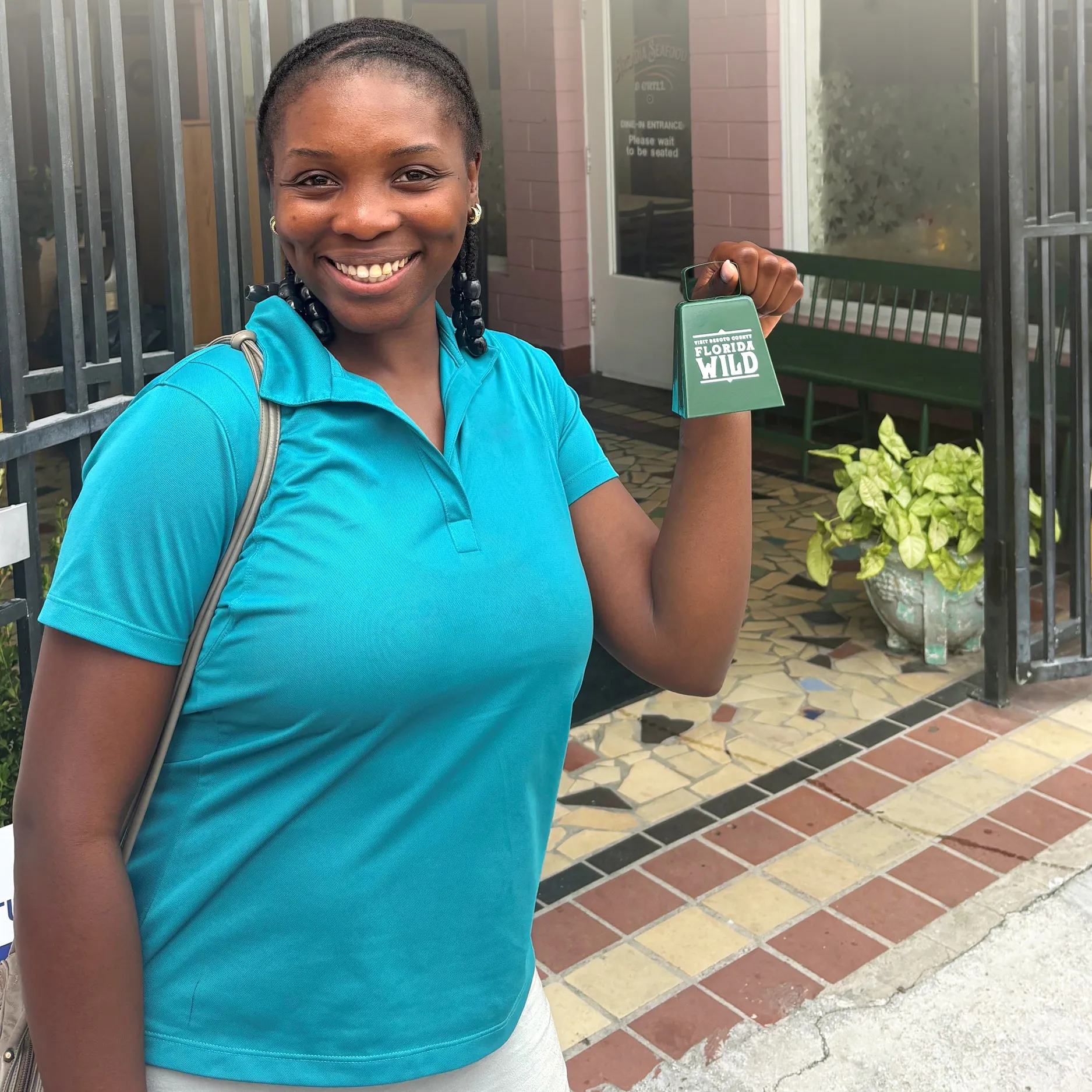 Person holding a cowbell