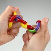 a close up of hands holding a colorful chain