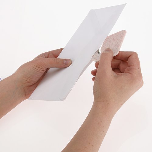 Additional Image 1 - a person holding a piece of paper