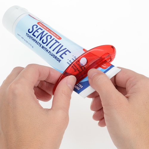 Additional Image 1 - hands holding a tube with a red cap