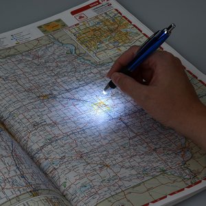 Additional Image 1 - a hand holding a pen on a map