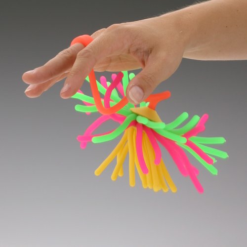 Additional Image 1 - a hand holding a bunch of colorful plastic objects