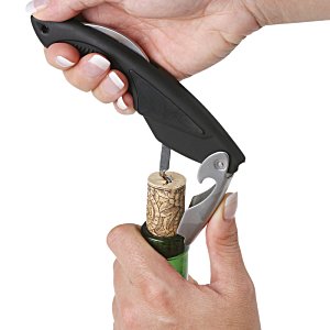 Additional Image 1 - a person opening a bottle of wine