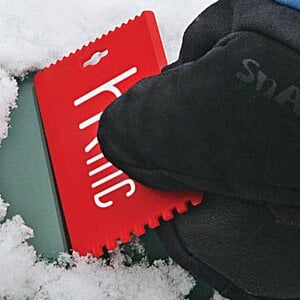 Additional Image 1 - a person holding a red object in the snow