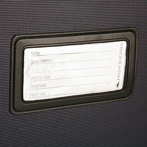 Additional Image 5 - a rectangular white label on a black surface