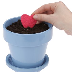 Additional Image 2 - a hand holding a small red heart in a blue pot