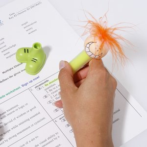 Additional Image 1 - a hand holding a yellow marker