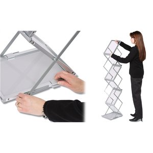 Additional Image 1 - a woman standing next to a hand holding a white object