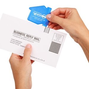 Additional Image 1 - a person holding a white envelope