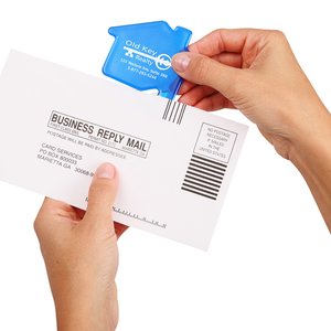 Additional Image 1 - a person holding a white envelope