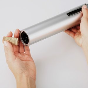 Additional Image 3 - a person holding a roll of foil