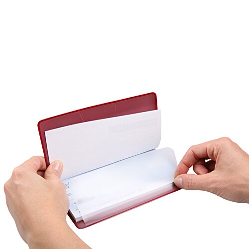Additional Image 1 - a person holding a red and white book