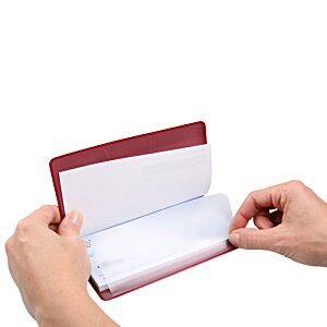 Additional Image 1 - a person holding a red and white book