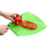 a person cutting vegetables on a cutting board