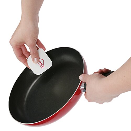 Additional Image 2 - a person holding a white sponge over a black pan