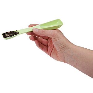 Additional Image 1 - a hand holding a green toothbrush