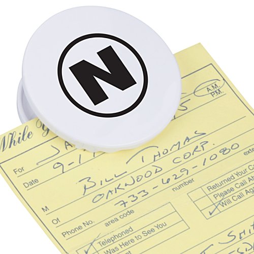 Additional Image 1 - a white circle with black letter on a yellow paper