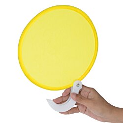 a hand holding a yellow circle