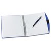 a white notebook with a pen