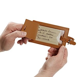 Additional Image 1 - a person holding an orange tag