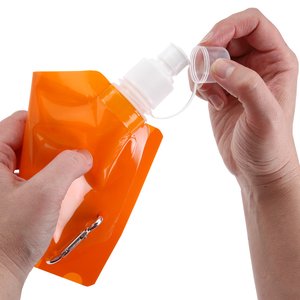 Additional Image 1 - a person spraying a bottle of sunscreen