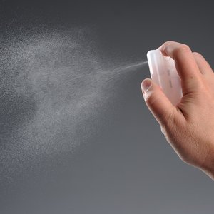 Additional Image 1 - a person spraying a white object