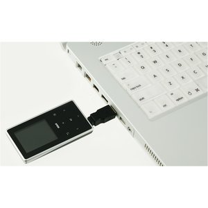 Additional Image 2 - a black cell phone plugged into a white keyboard