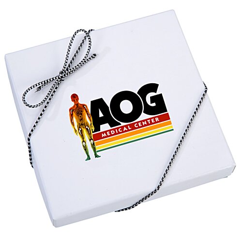 Additional Image 1 - a white square box with a black ribbon