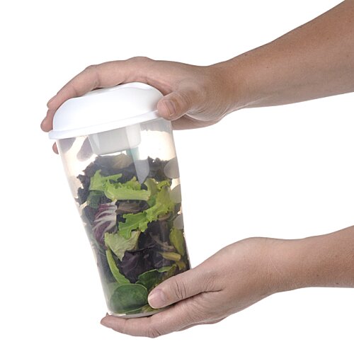 Additional Image 3 - a person holding a container with a green substance