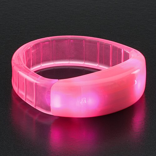 Additional Image 5 - a pink plastic ring on a black surface