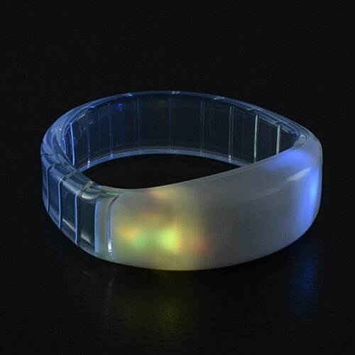 Additional Image 6 - a clear plastic ring with a light reflecting on it