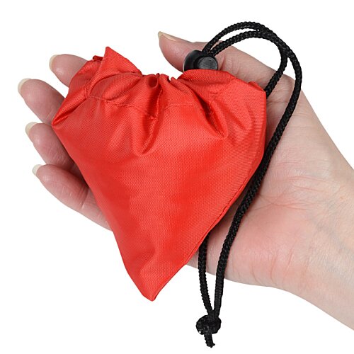 Additional Image 2 - a hand holding a black heart shaped device