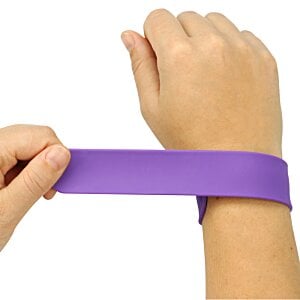 Additional Image 2 - a person's hands putting a purple band on their wrist