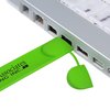 a green usb stick connected to a laptop