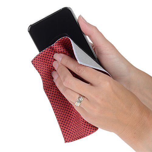 Additional Image 1 - a hand holding a phone and a cloth