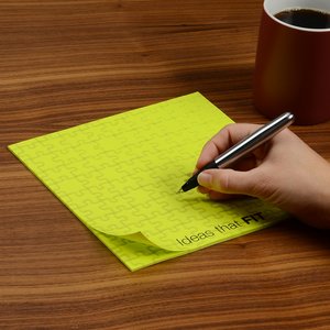 Additional Image 1 - a hand holding a pen on a yellow paper