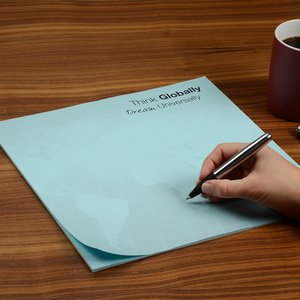 Additional Image 1 - a hand holding a pen on a piece of paper