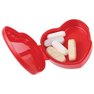 Additional Image 1 - a red heart shaped container with white pills inside